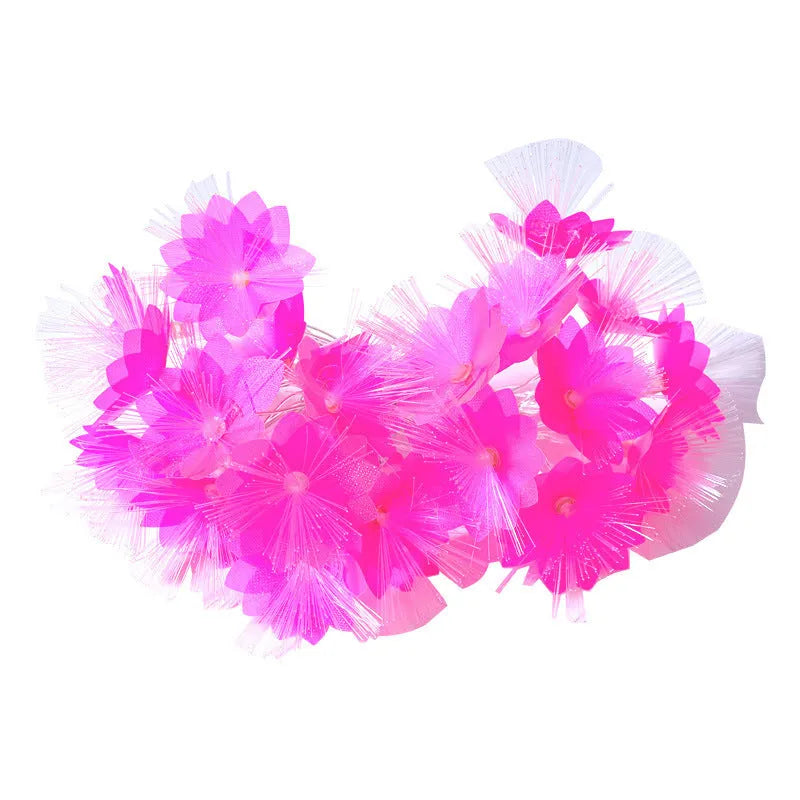LED optical fibre flower light string with battery box, 20 warm white beads on a dark background
