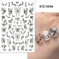 Pack of black and silver striped nail art stickers with cartoon and love pattern designs.