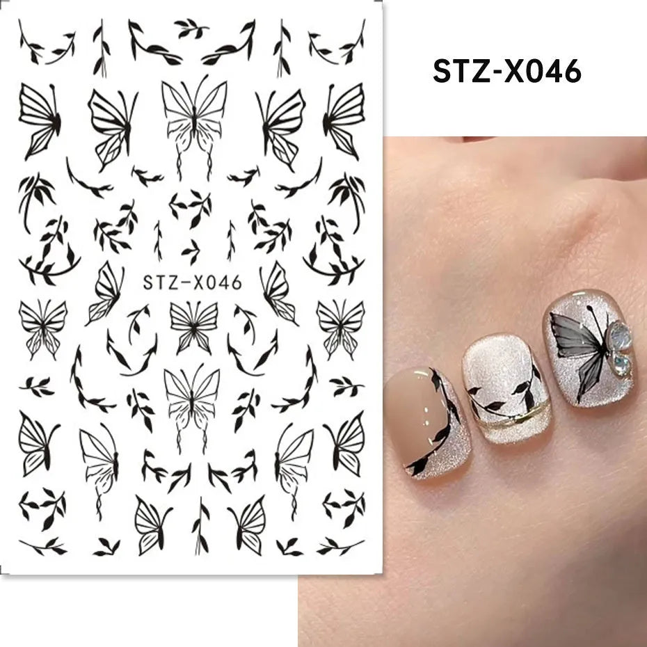 Pack of black and silver striped nail art stickers with cartoon and love pattern designs.