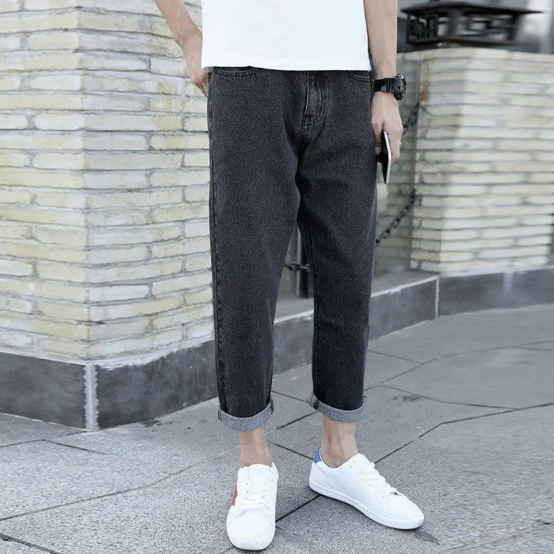 Men's straight-leg harem jeans in black or blue cotton fabric showing loose fit design