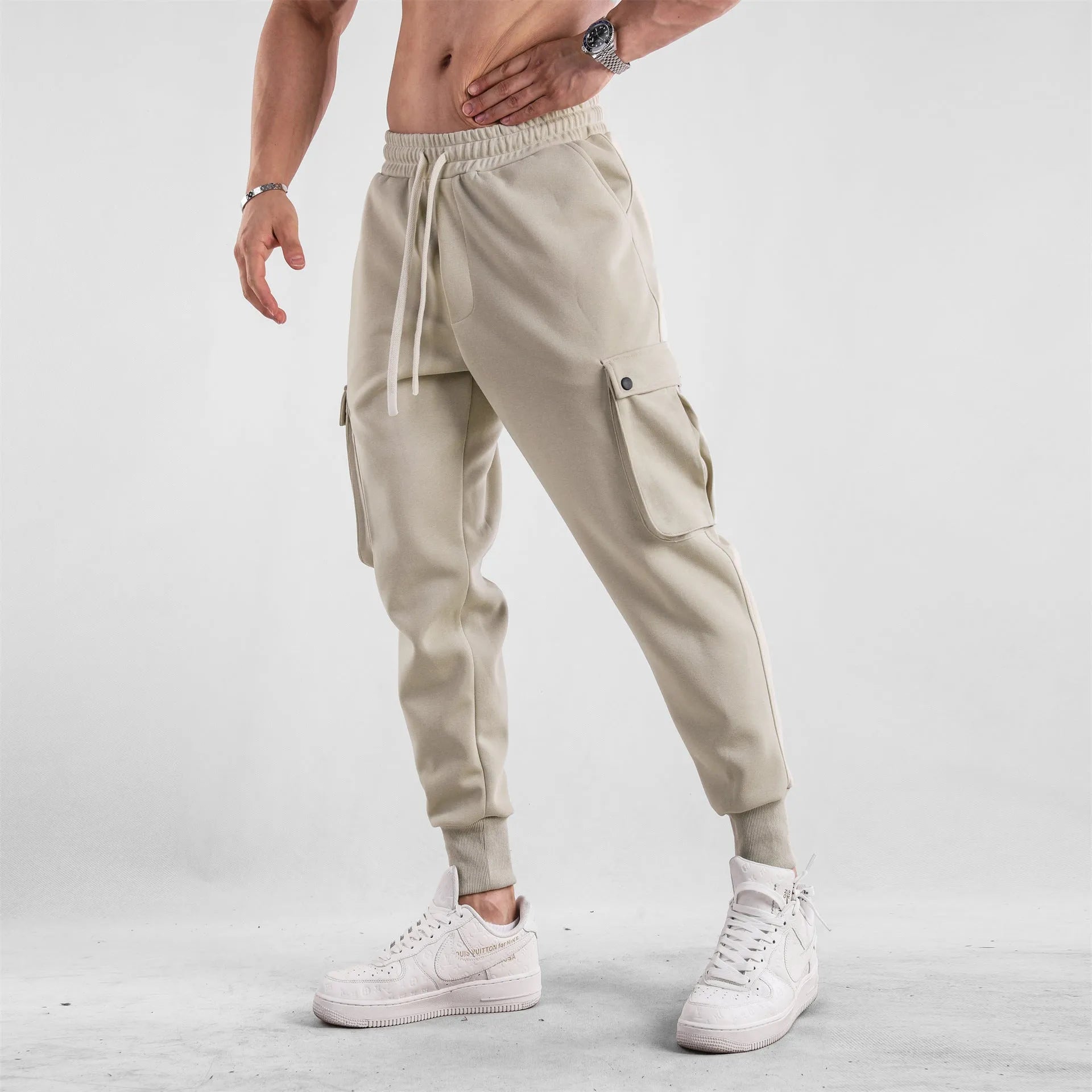 Men's cotton sports trousers with ankle ties and multiple pockets in apricot colour