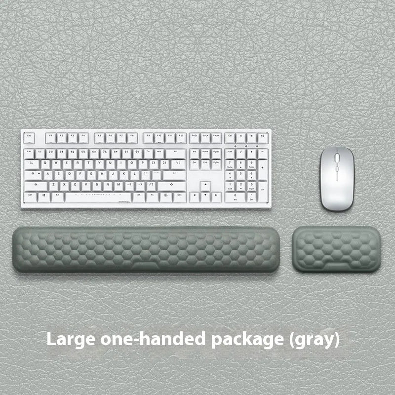 Memory foam mouse wrist rest with silicone base in black cloth and grey leather style options.