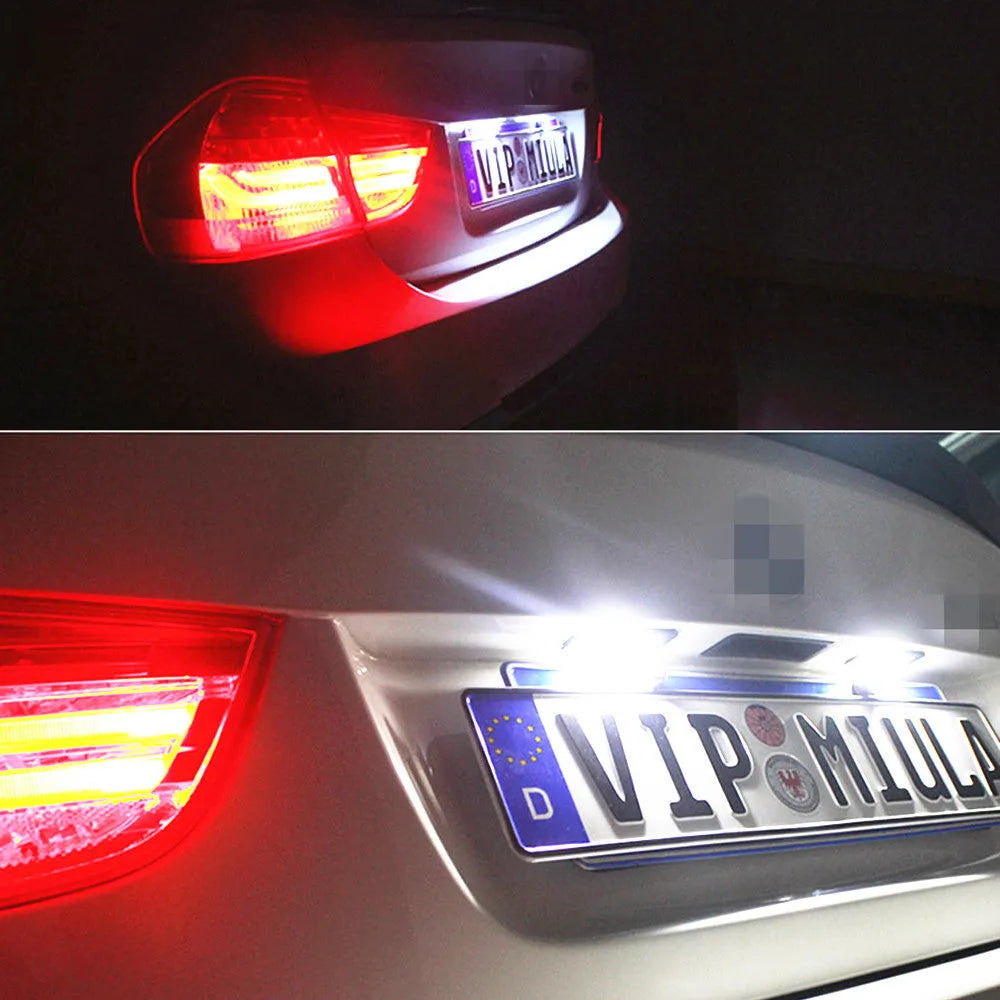 Two Volkswagen LED license plate light units with multiple white SMD LEDs visible.