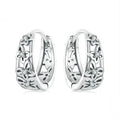 Sterling silver butterfly earrings with hollow retro design and zircon accents
