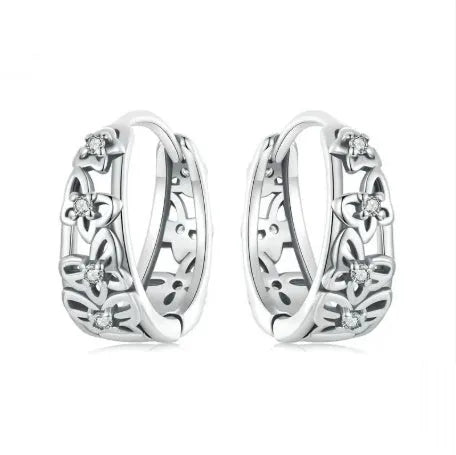 Sterling silver butterfly earrings with hollow retro design and zircon accents