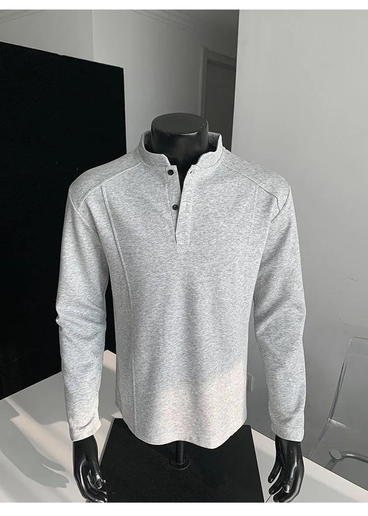 Men's grey asymmetrical stand-up collar cotton polo shirt with patchwork shoulder detail.