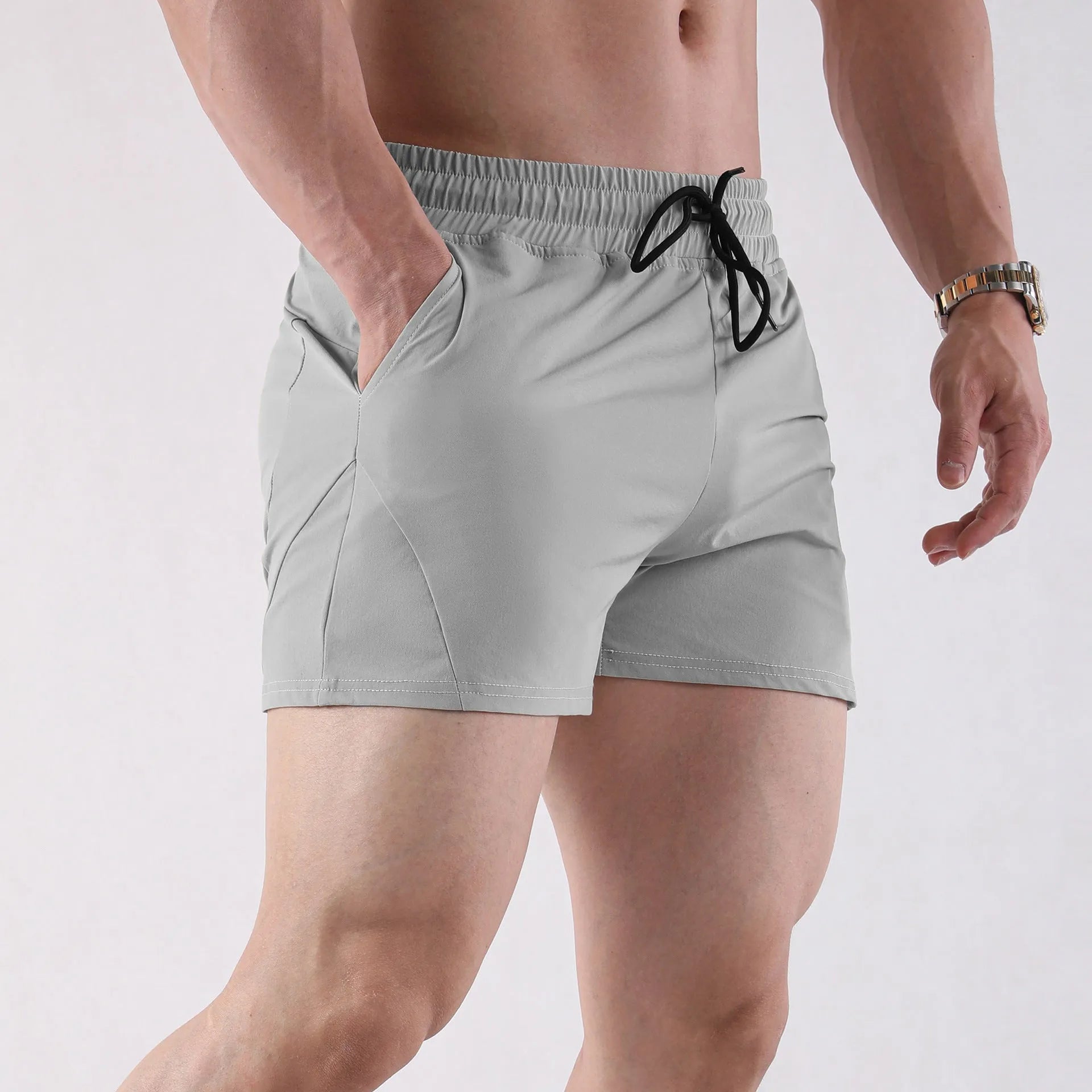 Men's thin polyester basketball shorts in apricot colour with elastic waistband.