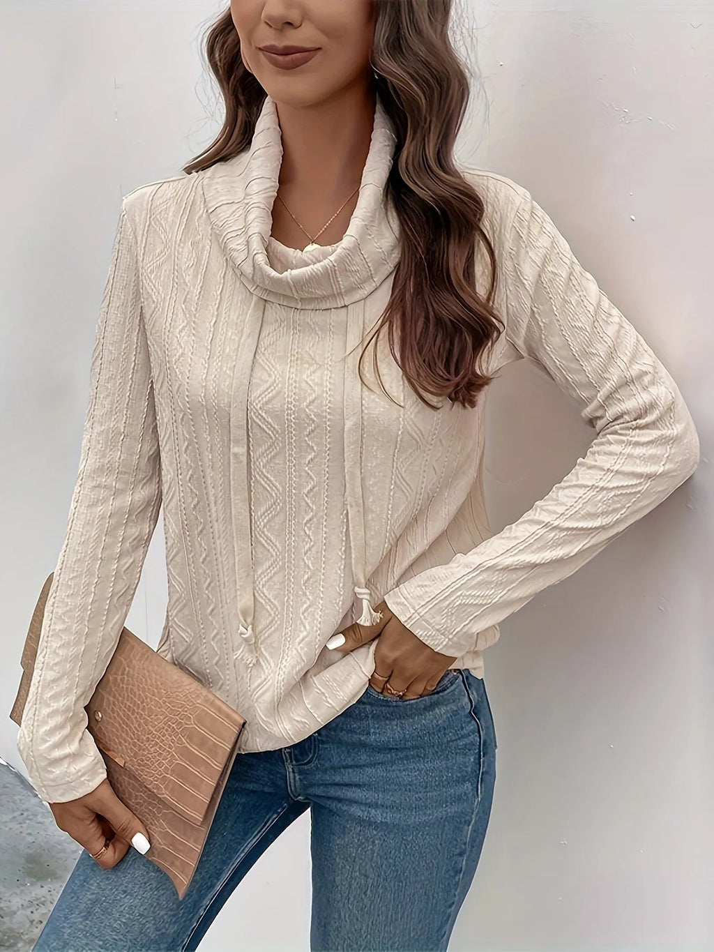 Apricot coloured long sleeve hooded pullover sweater with drawstring on mannequin