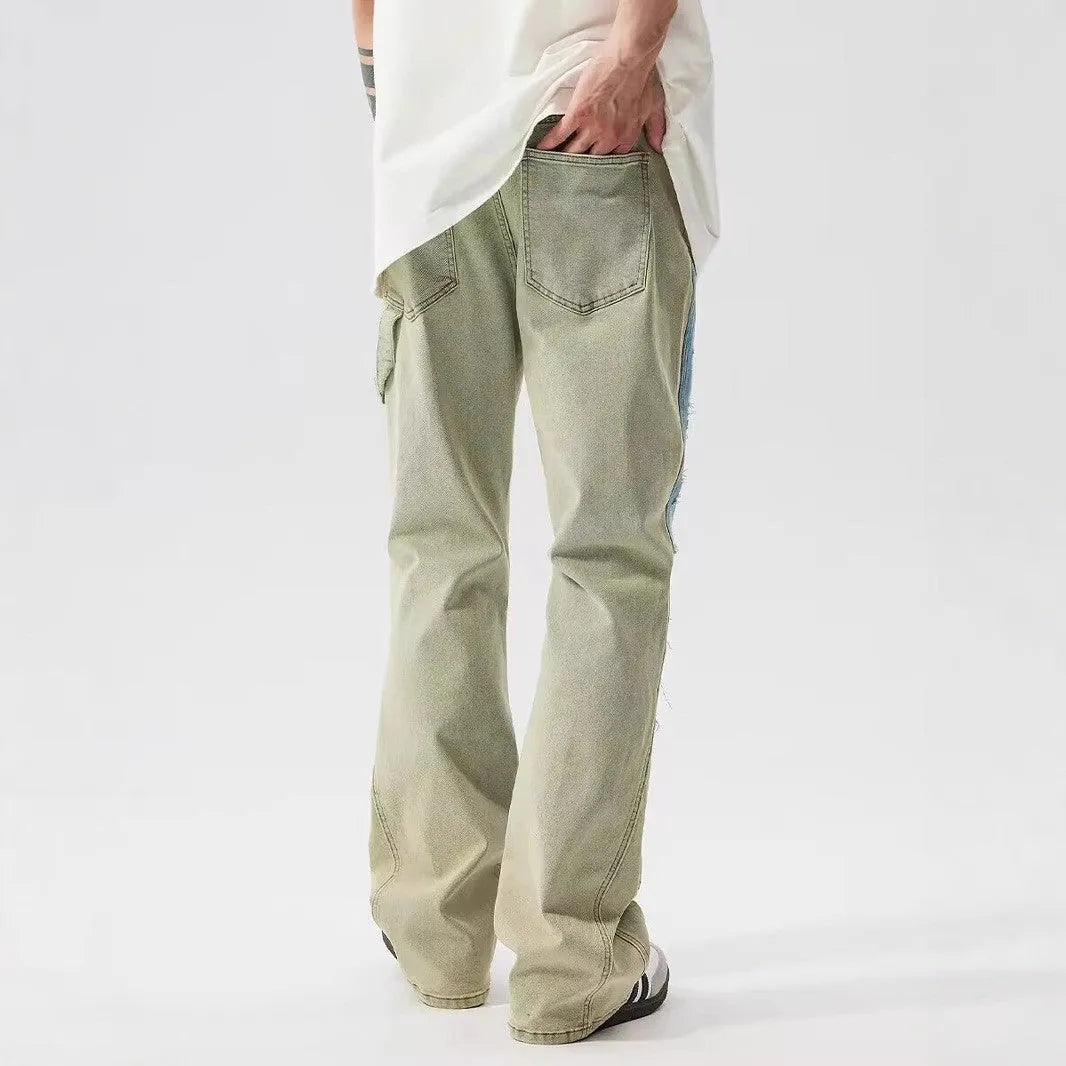 Retro yellow and blue patchwork jeans with splash-ink damaged design on denim fabric