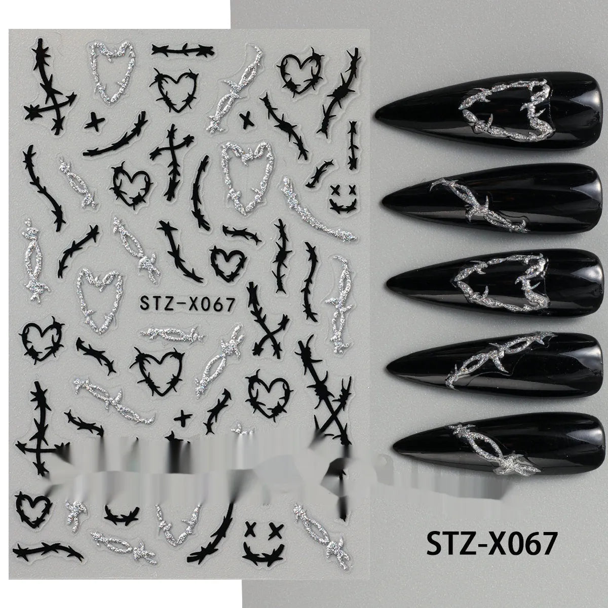 Pack of black and silver striped nail art stickers with cartoon and love pattern designs.