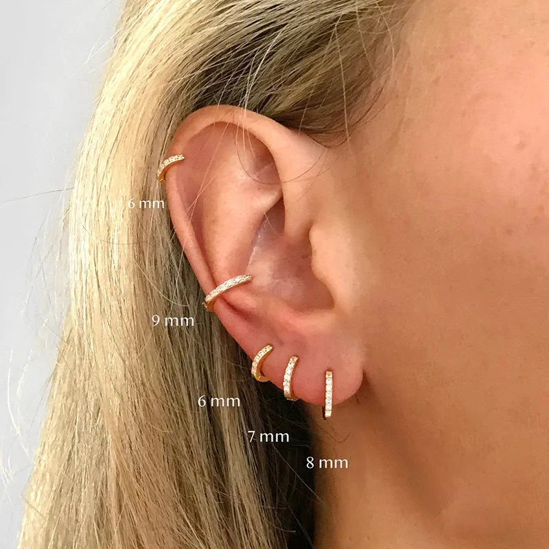Circle zircon perforated stud earrings in gold, rose gold, and silver colour options with geometry round design