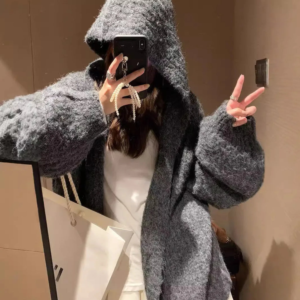 Women's dark grey loose-fit hooded cardigan sweater on a hanger