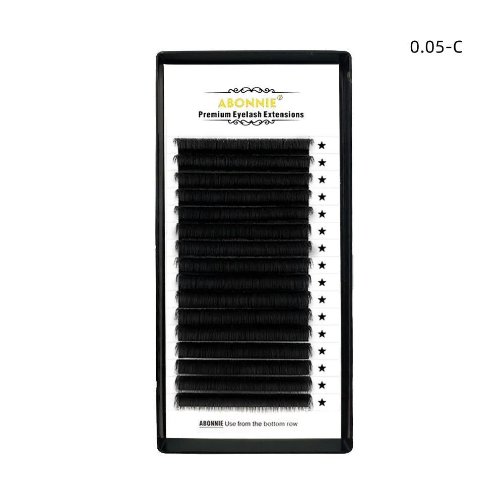 Pair of dense 16-row false eyelashes made from matte wool mink hair, showing voluminous length.