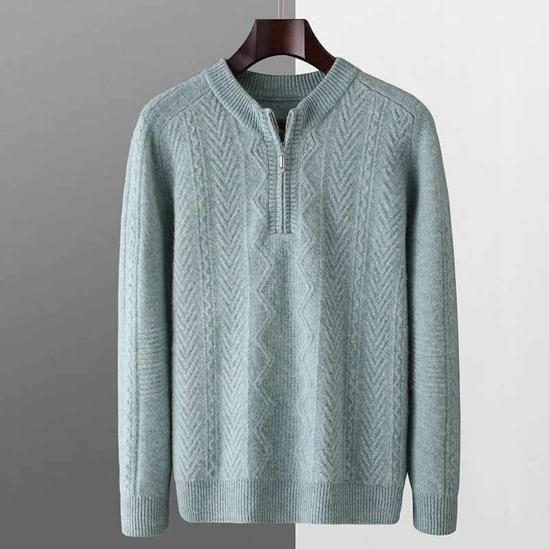 Men's grey wool half zip sweater with a diamond lattice pattern, shown on a model.