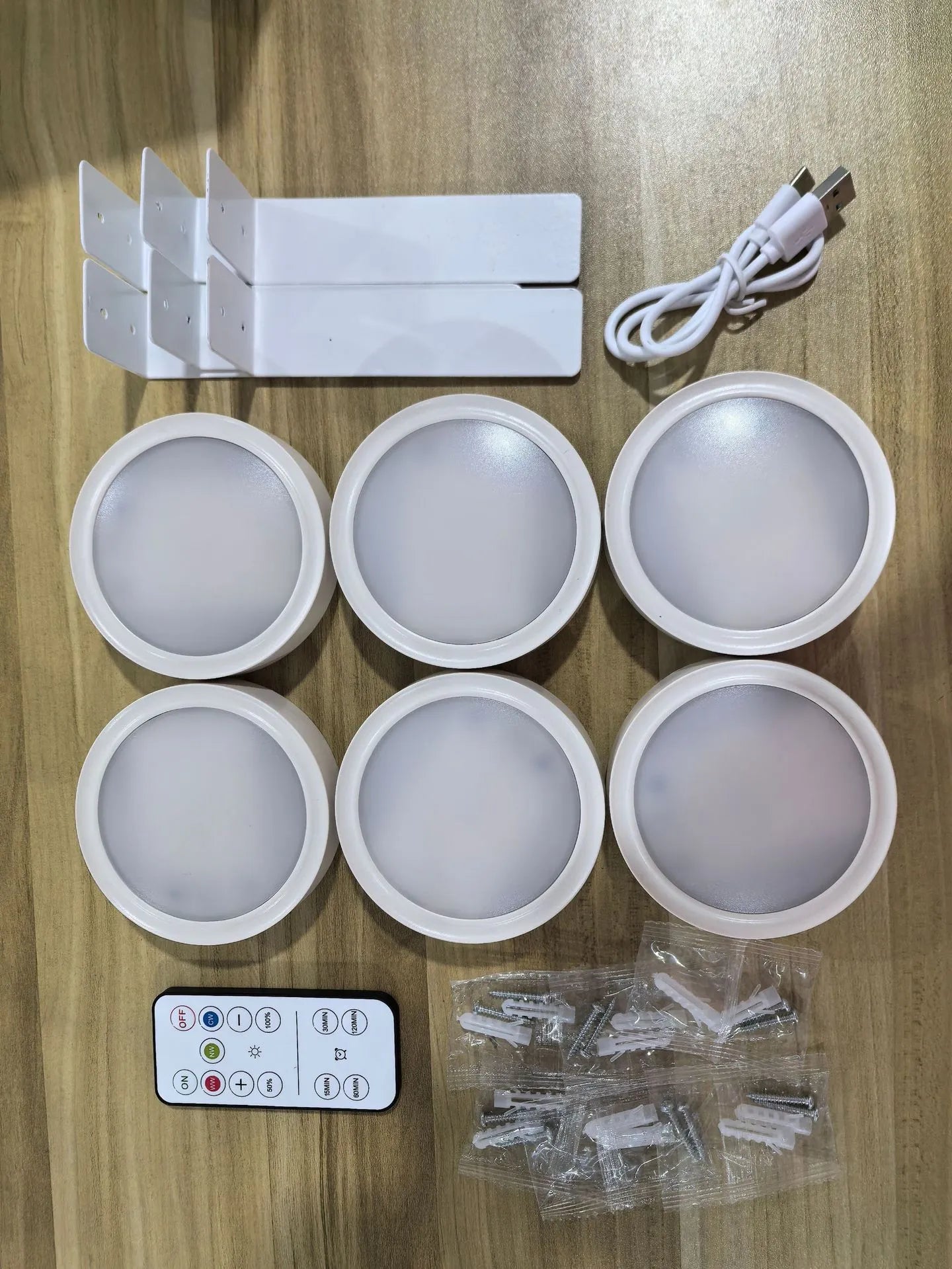 Wireless LED painting lamp with a magnetic mounting belt and remote control in black finish.