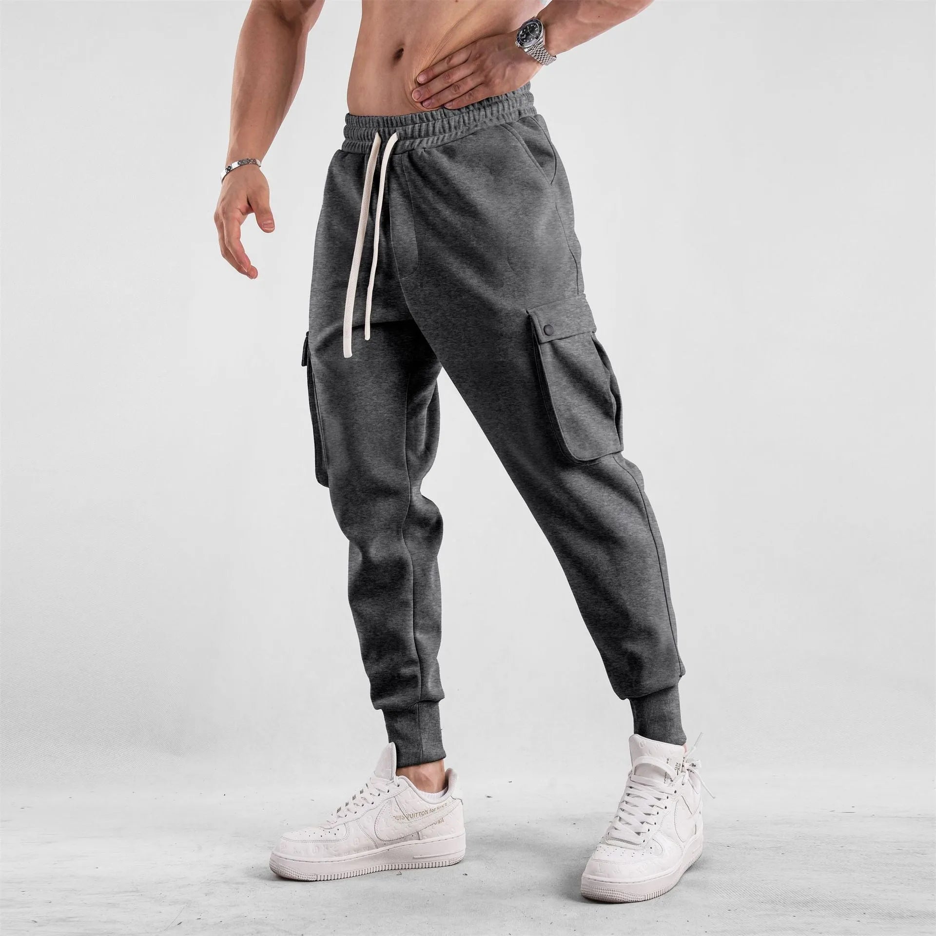 Men's cotton sports trousers with ankle ties and multiple pockets in apricot colour