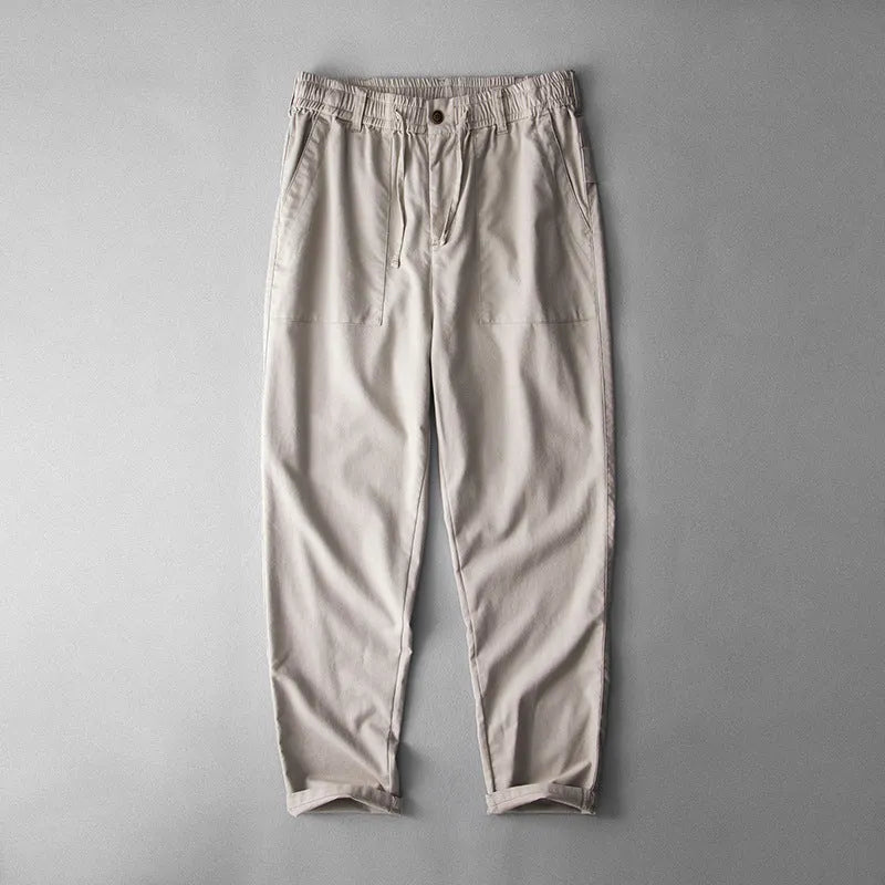 Men's solid colour linen casual trousers in navy blue, shown from the front.