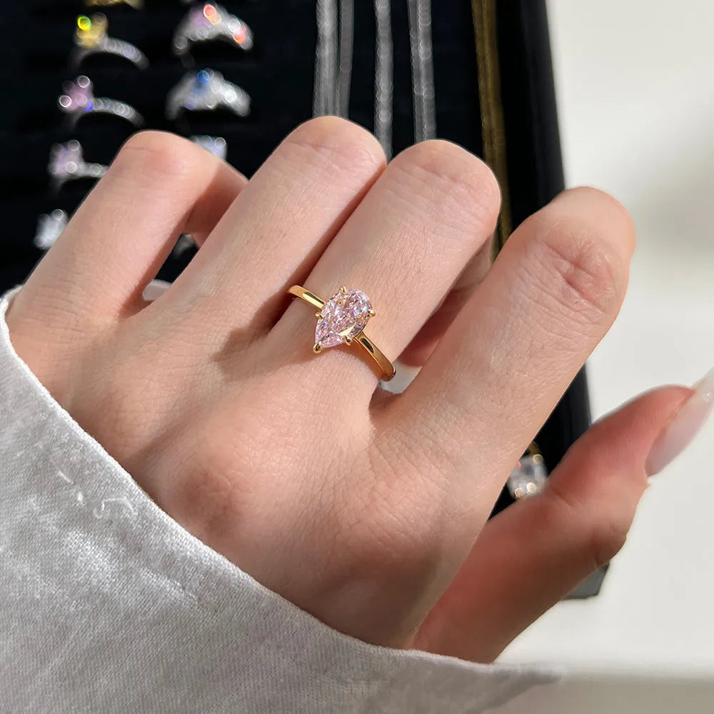 Sterling silver ring with pear-shaped high-grade zircon inlay, closed band, electroplated finish, multiple colours available