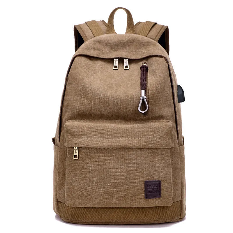 Canvas backpack with USB charging port showing laptop compartment and multiple pockets