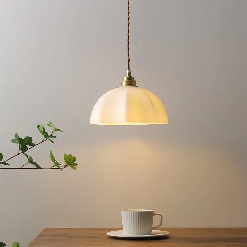 Brass small droplight with copper glass in a Chinese style design.