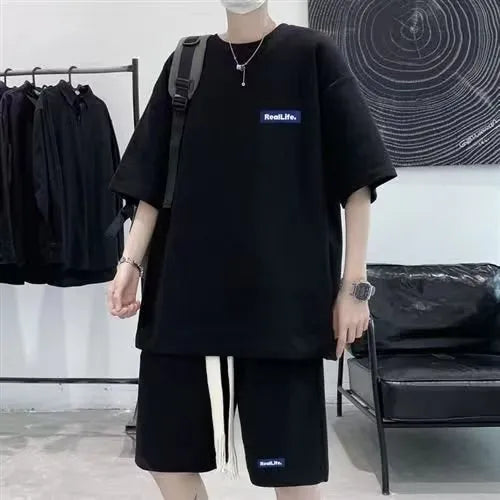 Waffle textured men's leisure sports suit with short sleeves and matching shorts in cotton-polyester blend