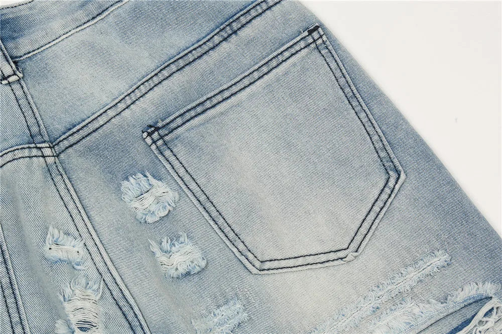 Men's light blue flared washed denim jeans with zipper fly on a model