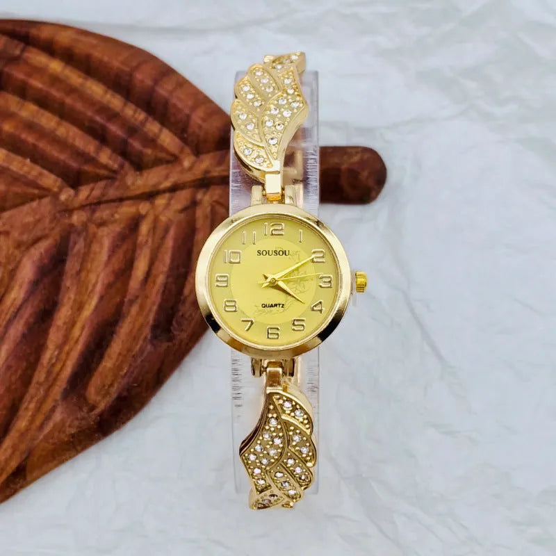 Women's stainless steel watch with round dial on wrist, showing Vachette clasp.