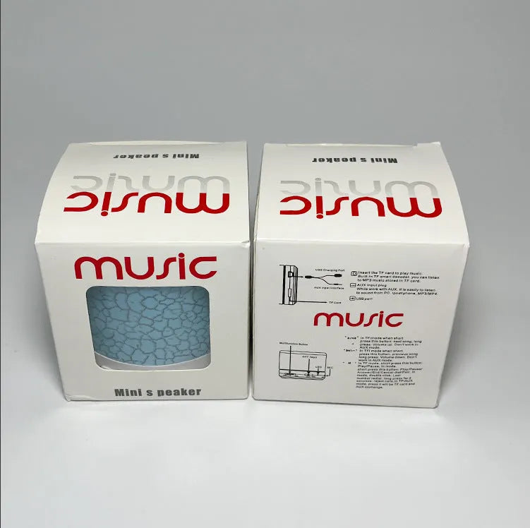 A9 Mini Cracked Bluetooth Speaker in blue with LED lights on a table