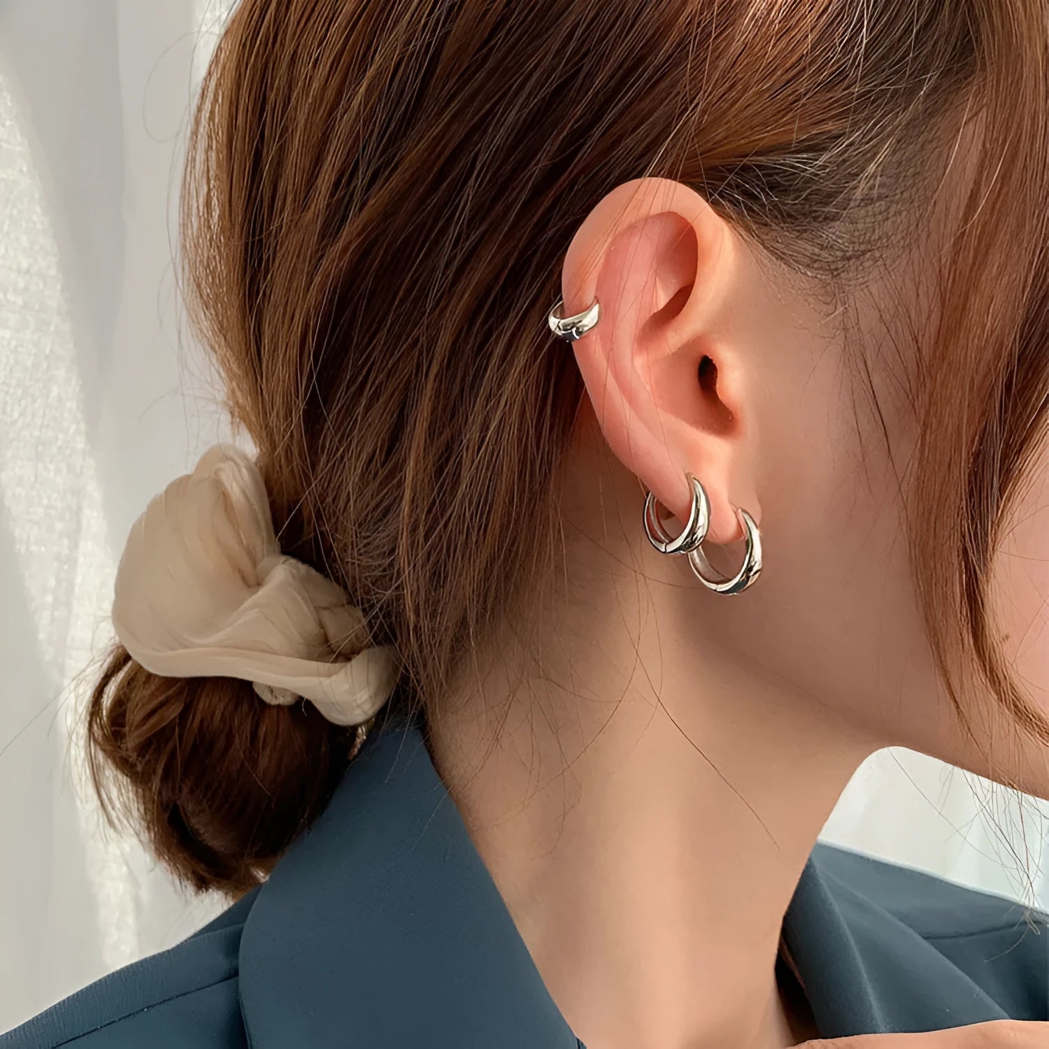 Geometric water drop earrings in gold or silver on a copper base, shown in small, medium, and large sizes.