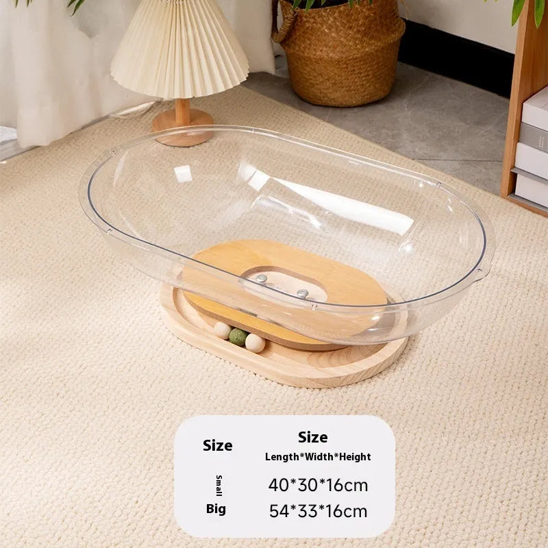 Transparent acrylic space capsule-shaped cat bed or enclosure on a turntable base.
