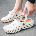 Men's beige EVA slipper sandals with hollow-out design and textured non-slip sole.