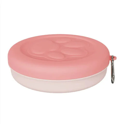 Portable plastic dog bowl with snack compartment and metal carrying clip in light green colour.