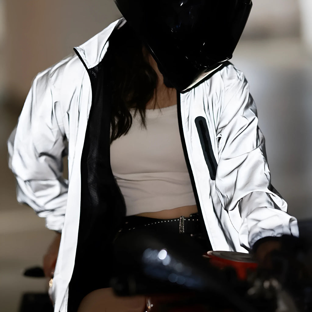 Silver waterproof polyester long sleeved jacket for outdoor wind and rain protection.