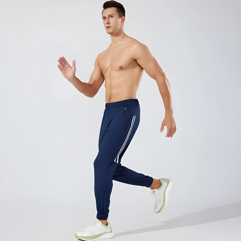 Men's black running trousers with mid waist design and breathable polyester construction for spring exercise