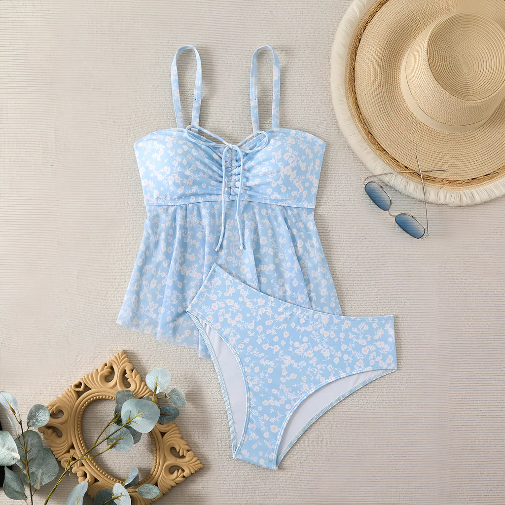 Light blue floral women's swimsuit set with shoulder straps and backless design, available in sizes S to XL