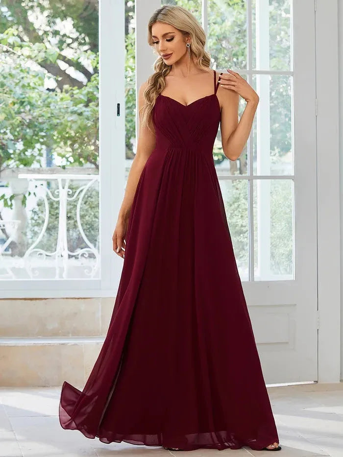 Women's long sleeveless A-line dress with pleated skirt in solid colour options