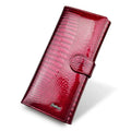 Women's red patent leather coin purse with embossed crocodile pattern texture.