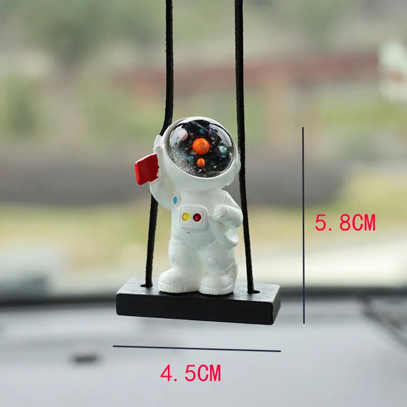 Resin cartoon astronaut car pendant decoration hanging from a rear-view mirror.