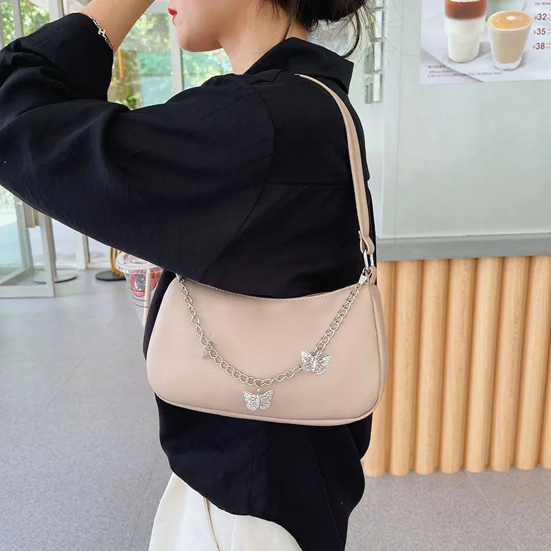 Retro women's chain-strap crossbody bag with butterfly charm in light blue PU leather