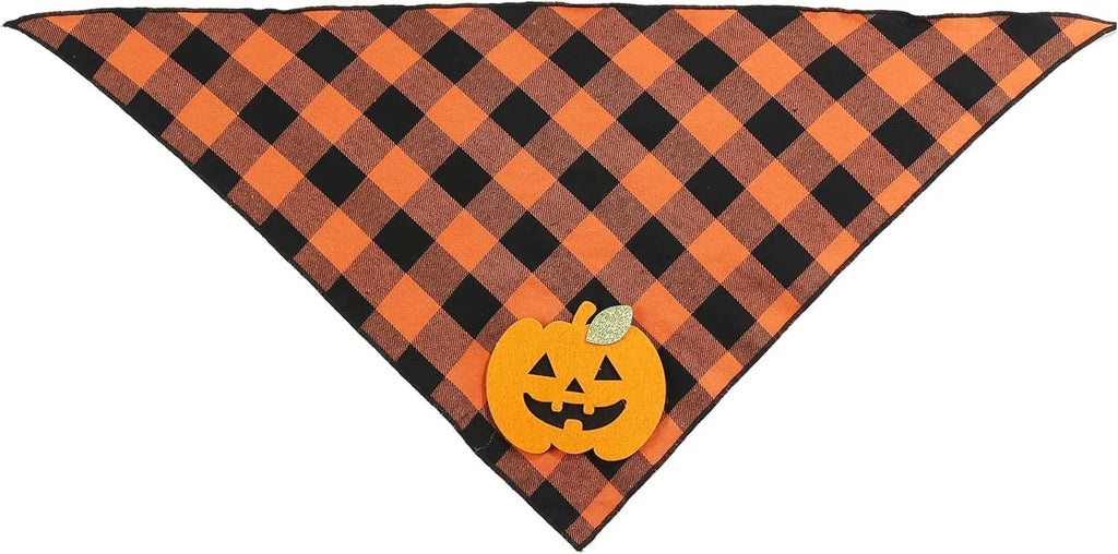 Orange plaid Halloween dog bandana with pumpkin and skeleton felt appliques on a white background