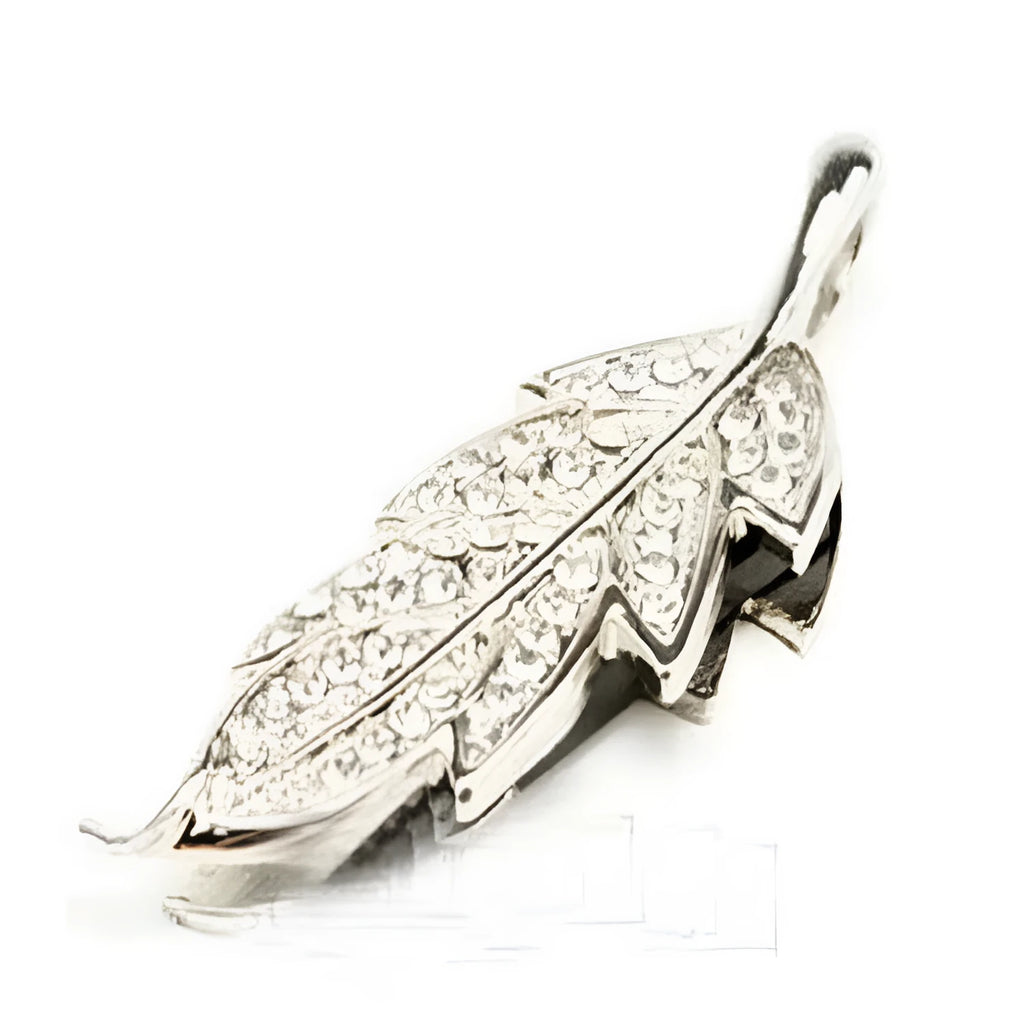 Silver metal USB flash drive with a crystal maple leaf decoration, showing front view.