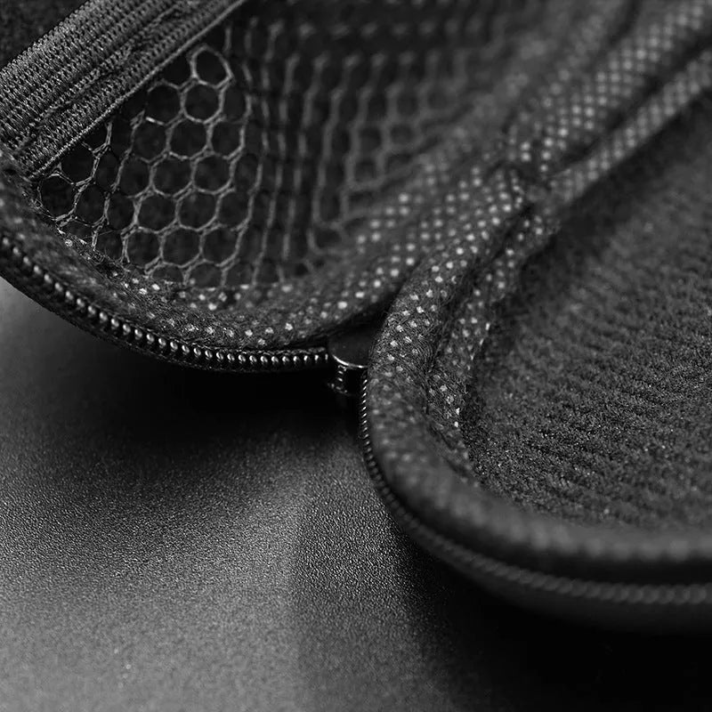 Black leather oval-shaped earphone storage pouch for portable headphones.