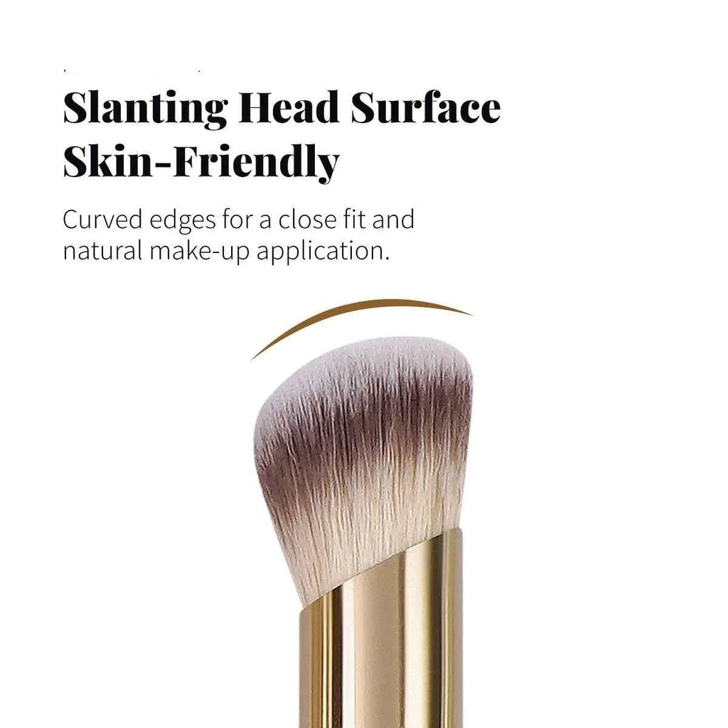 Angled apricot blusher brush and four other synthetic makeup brushes on a white surface.