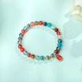 Women's agate bracelet with copper coin snake chain and coloured glaze detailing in geometric bead design
