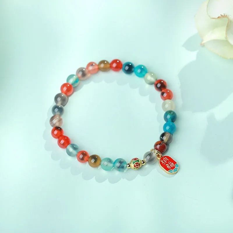 Women's agate bracelet with copper coin snake chain and coloured glaze detailing in geometric bead design