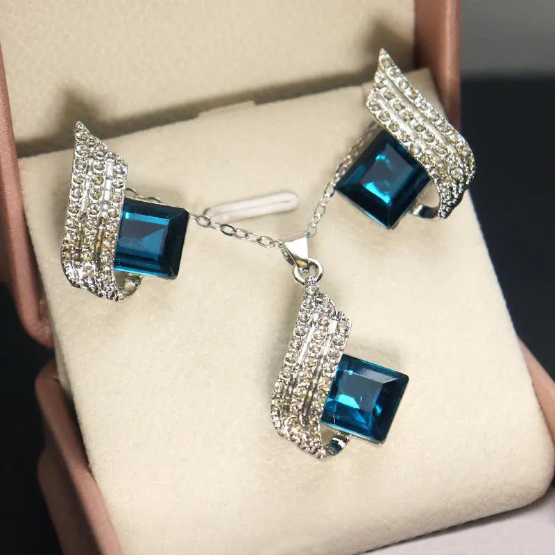 Women's alloy and glass necklace with matching ear stud set featuring cross chain design