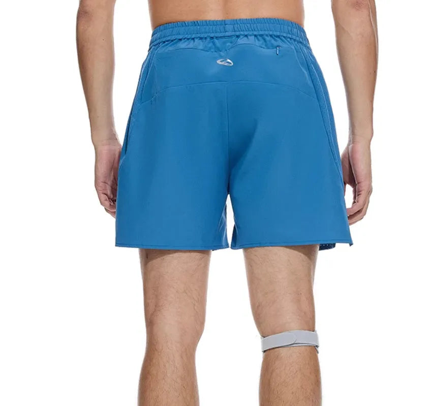 Men's black running shorts with laser stitching on a grey background, showing stretch fabric.