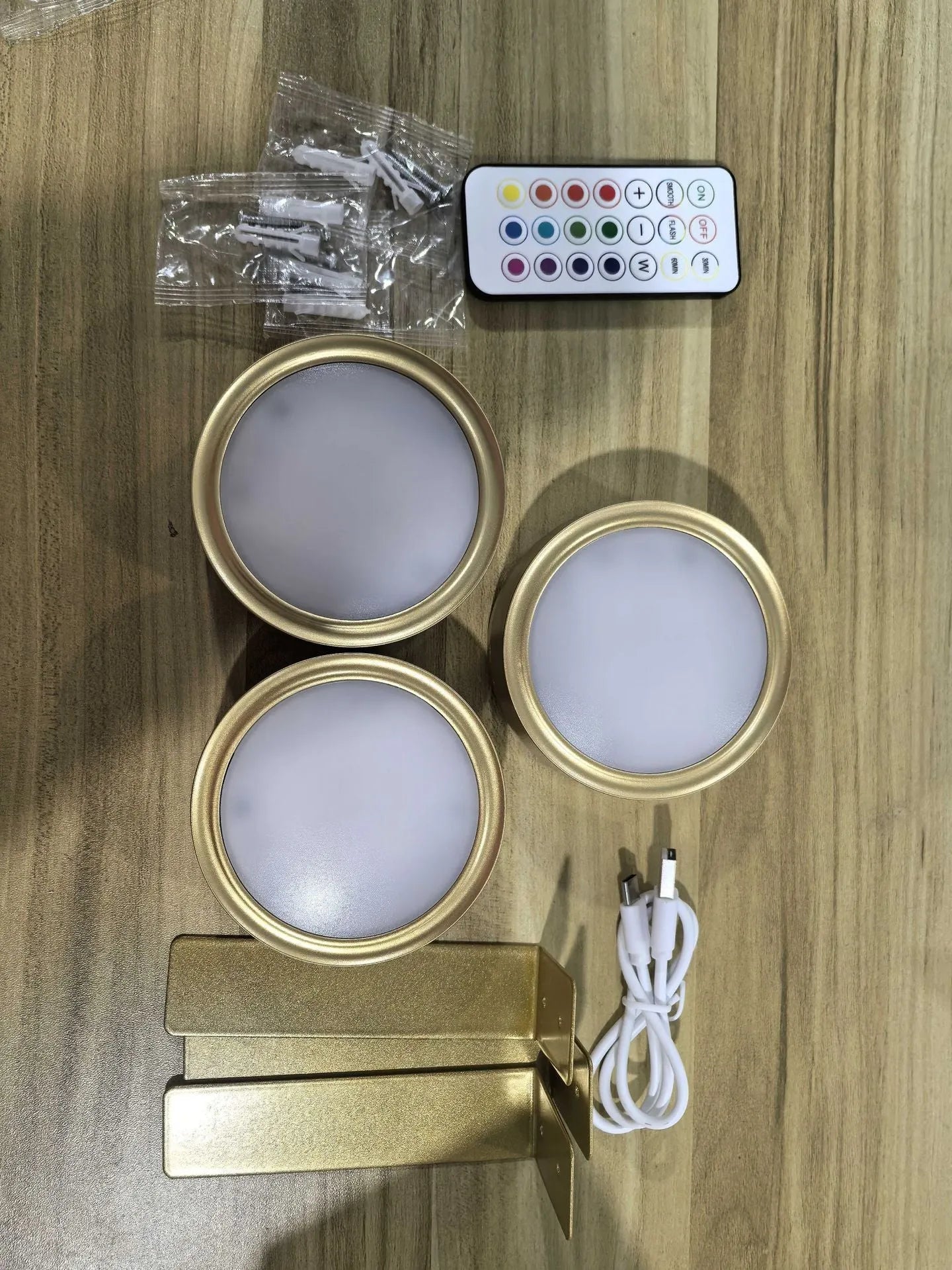 Wireless LED painting lamp with a magnetic mounting belt and remote control in black finish.