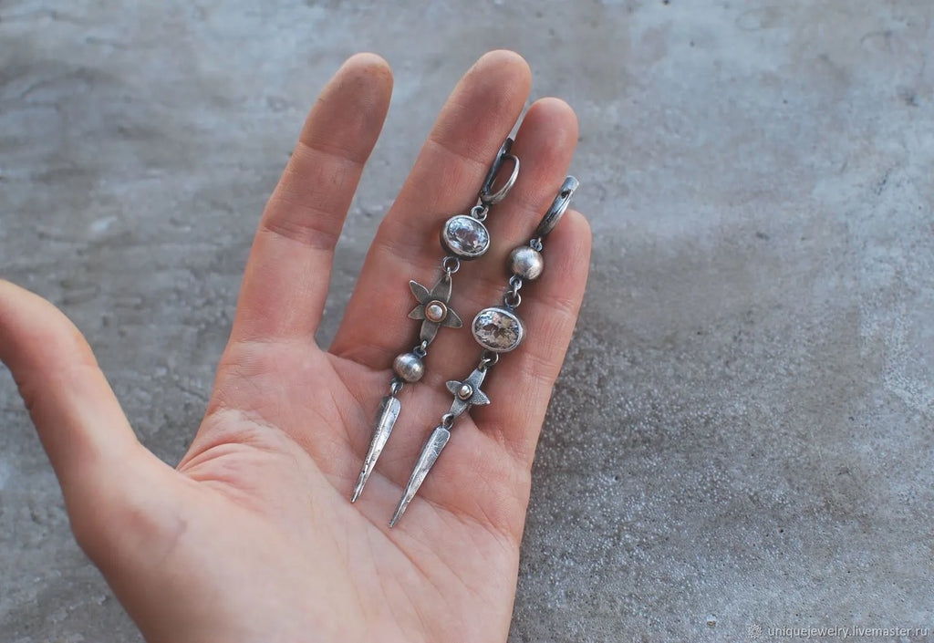 Geometric antique silver pendant earrings with XINGX design and rhinestone accents