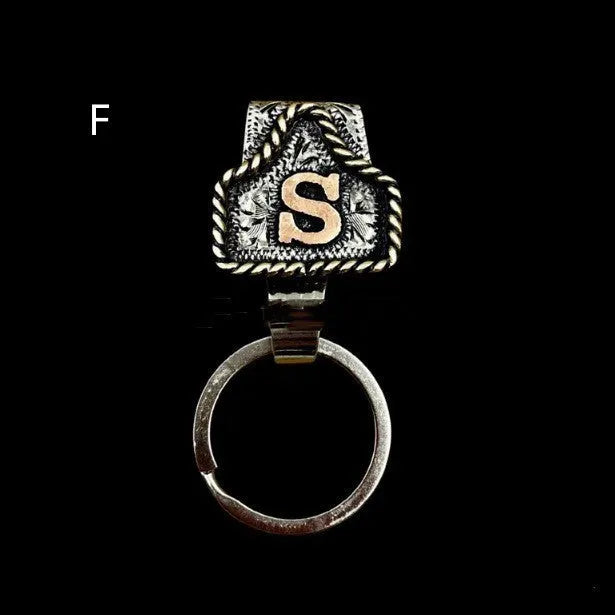 Handmade metal cow tag belt keychain in a selected colour from the A-Z letter range.